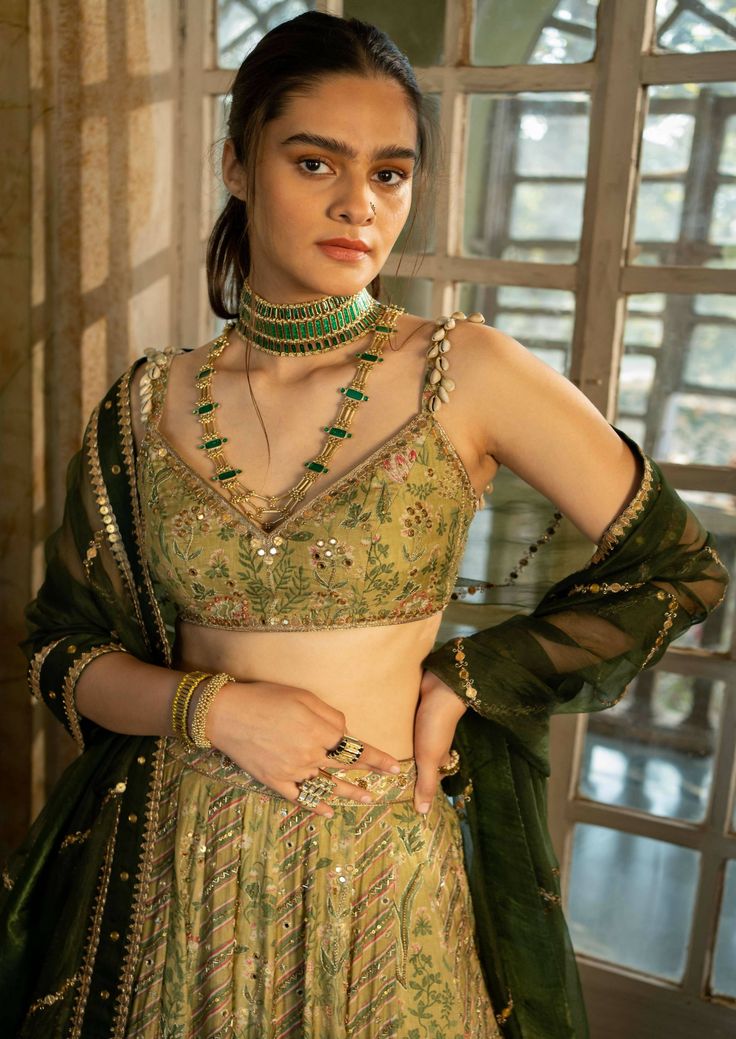 Featuring sage green lehenga set in our signature combination prints paired with a tissue dupatta with antique gold hand embroidery. Sage Green Lehenga, Tissue Dupatta, Shyamal And Bhumika, Gold Lehenga, Printed Lehenga, Raw Silk Lehenga, Satin Fashion, Green Lehenga, Gold Outfit