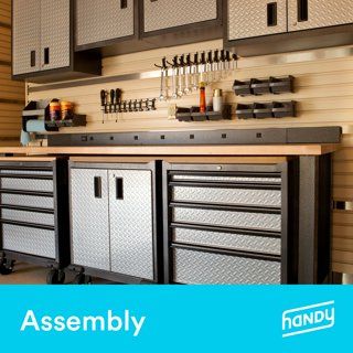 an assembly room with many drawers and tools on the wall, along with other cabinets