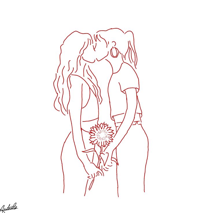 two women standing next to each other and holding flowers in their hands, one is kissing the other