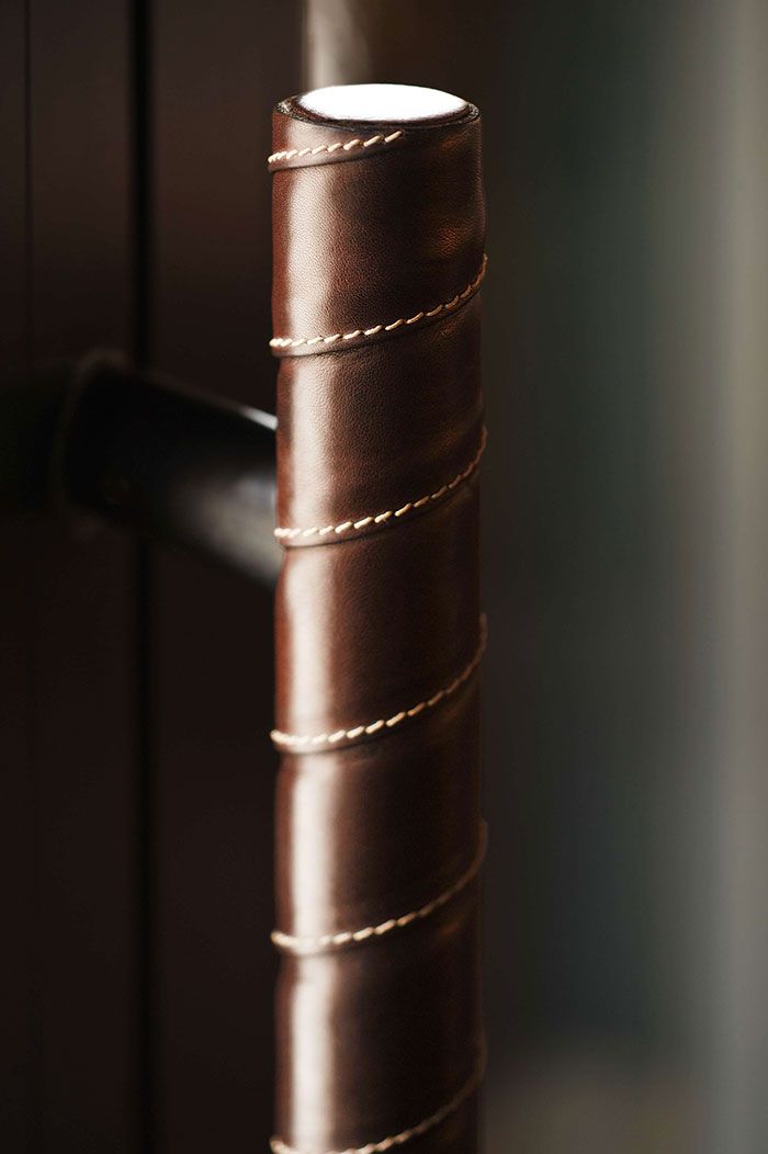 a close up view of a tall brown vase