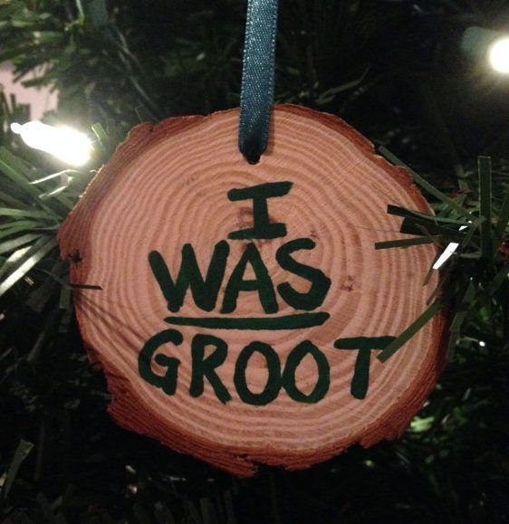 a christmas ornament that says i was groot on the front of a tree