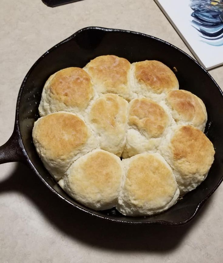 a cast iron skillet filled with biscuits