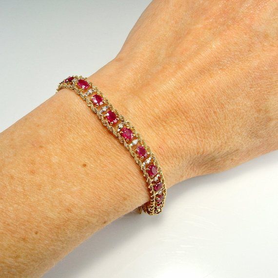 Here we have an astonishing natural no heat vivid red ruby and sparkly diamond bracelet crafted in solid 14K yellow and white gold. This bracelet has an extraordinary amount of work in it to handmade so many of the delicate links and assemble them. It is beautifully made and this fact means it drapes beautifully around the wrist line. Like all the best luxury jewelry this feels beautiful to wear. In total it weighs approximately 13 grams. The clasp is marked 14K and professional testing does con Luxury Ruby Elegant Bracelet, Luxury Elegant Ruby Bracelet, Luxury Pink Ruby Bracelets, Luxury Classic Ruby Bracelets, Red Ruby Bracelet, Ruby Bracelet, Twisted Bracelet, Basic Jewelry, Diamond Solitaire Necklace