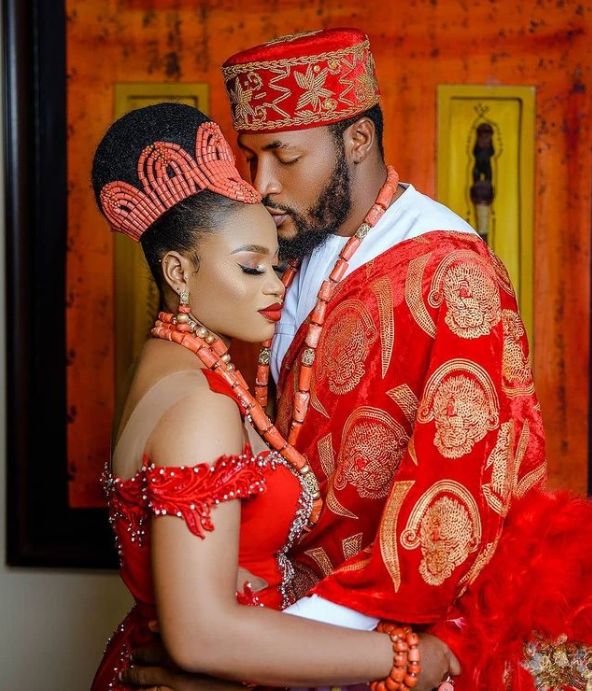 a man and woman dressed in traditional african clothing