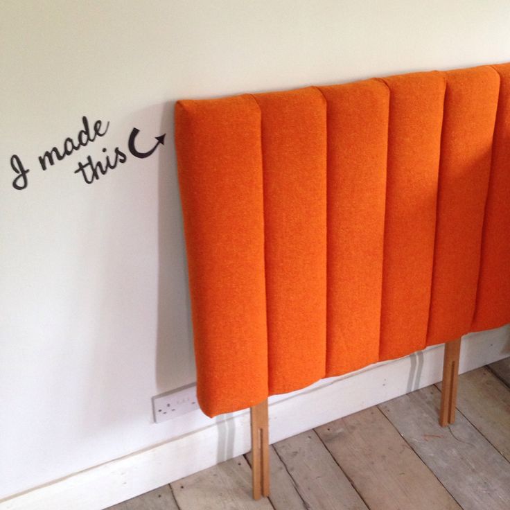 an orange headboard against a white wall with the words made this written on it