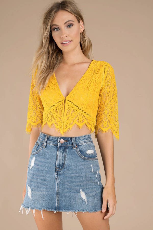 A crop top that you can take to all your upscale events. The Yvonne Lace Yellow Crop Top features gorgeous half sleeves, a plunging neckline, and a be #shoptobi Men Wearing Skirts, Yellow Crop Top, Miniskirt Outfits, Blouse Design Models, Crop Top Outfits, Yellow Lace, Lace Crop Tops, Blue Skirt, Scalloped Hem