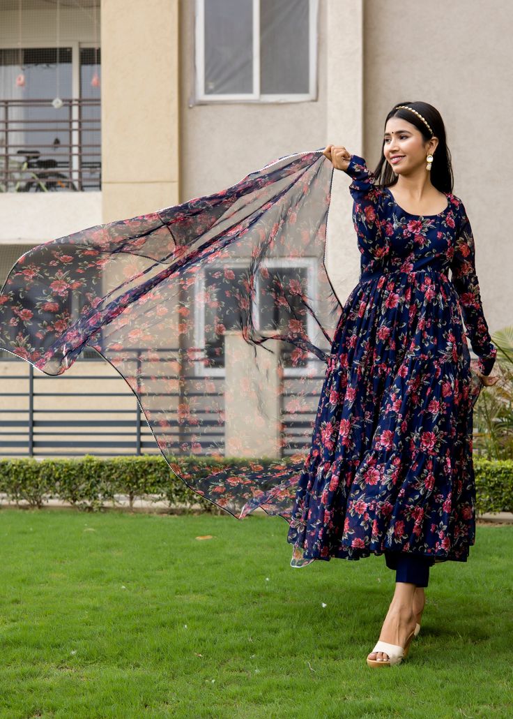 PRODUCT DESCRIPTION :- Be the twirl ready this festive season in our floral printed Anarkali . Crafted with premium chanderi cotton and classy silhouettes.Anarkali :- chanderi cottonPant :- CottonDupatta :- Organza silkClosure Used:- Side zipColor:-Anarkali and dupatta - Navy blue Pant - Navy BlueCare Instructions :- Dry clean onlyModel Size :- Model is wearing XS sizeModel Height :- 5.6''DISCLAIMER :- Slight color variations may occur due to different screen resolution. Blue Floral Chanderi Kurta, Blue Floral Print Dupatta For Navratri, Blue Floral Print Anarkali Set For Navratri, Festive Blue Floral Print Anarkali Set, Festive Blue Floral Anarkali Set, Anarkali Salwar Kameez With Floral Print And Long Sleeves, Blue Bollywood Style Kurta With Floral Print, Blue Fitted Anarkali Set With Floral Print, Floral Print Long Sleeve Anarkali Set For Festivals