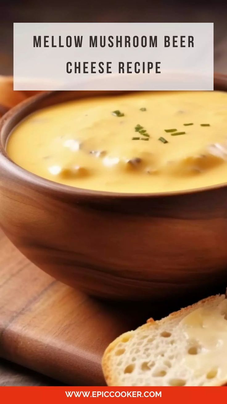 a wooden bowl filled with cheese soup next to a piece of bread on a cutting board