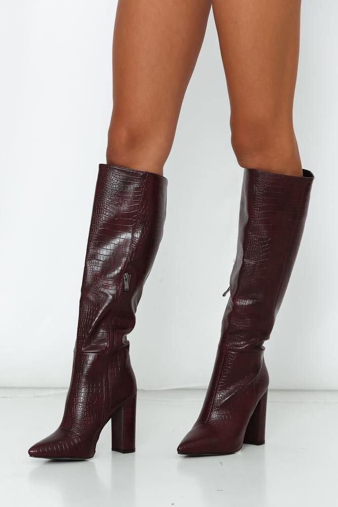 Burgundy boots. Croc finish. Non-leather upper, lining and sole. Inner gold-tone zipper. Approx 41cm boot shaft. Approx 1cm sole. Approx 5.5cm heel. Size 8 is an EU39. This shoe runs true to size. Block heel. These boots are MADE for walking! Sleek and undeniably chic, your new go-to boot is a definite must-have. We're screaming. Set on a sky-high block heel, your new boot offers a classic pointed to, finished in a faux croc finish and an inner zipper for ease of wear.