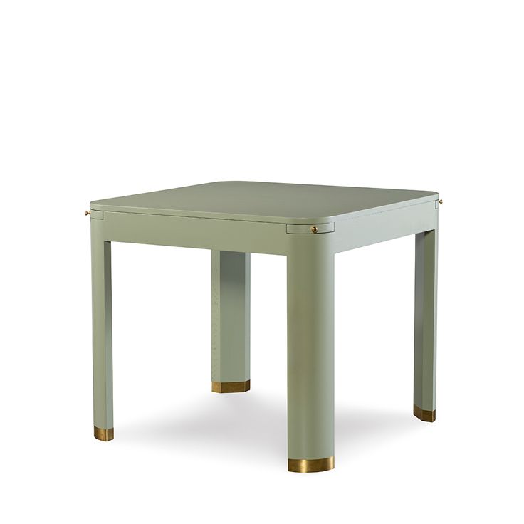 a small square table with gold legs on an isolated white background