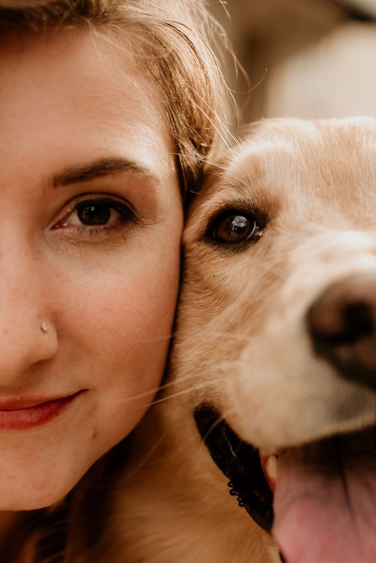 a close up of a person hugging a dog