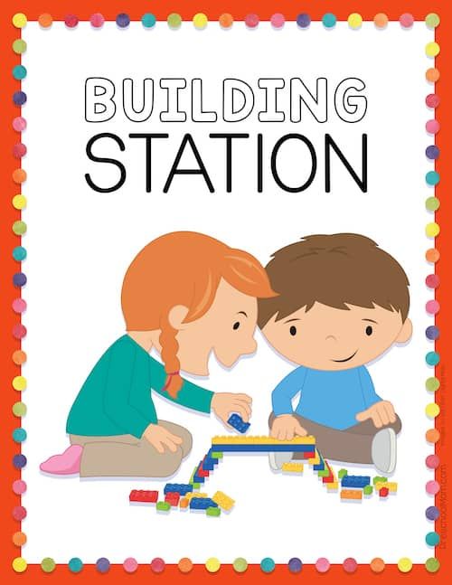 two children playing with blocks on the floor in front of a sign that says blocks station