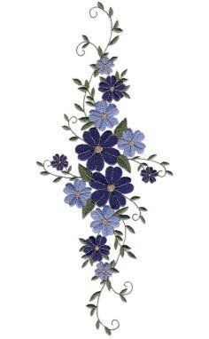 a cross with blue flowers and green leaves