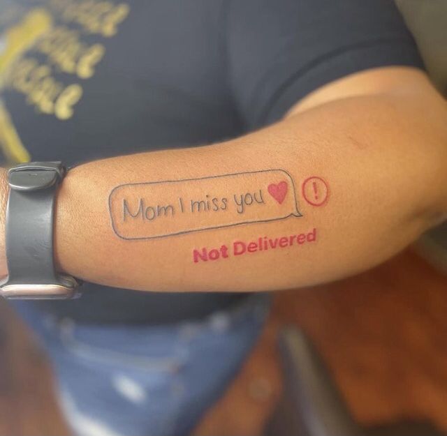 a person with a tattoo on their arm that says mom i miss you not delivered