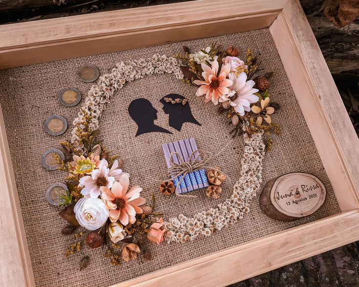 the shadow of a man and woman is made out of burlap with flowers