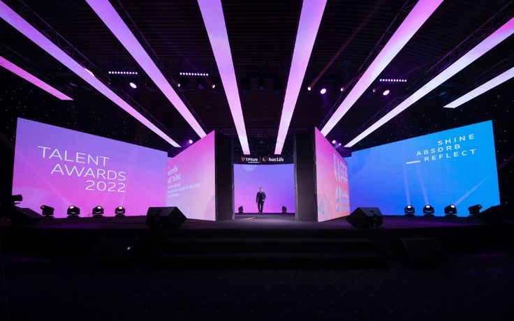 the stage is lit up with purple and blue lights for an award ceremony at talent awards 2012