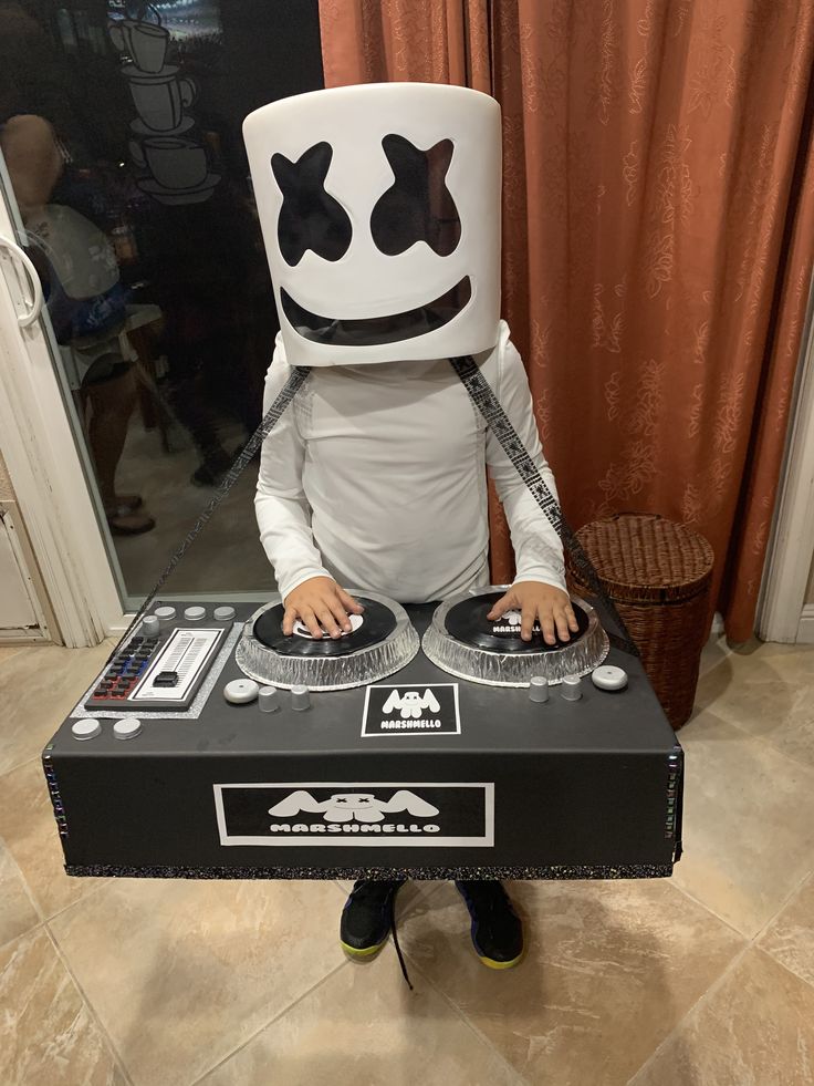 a person in a costume that is playing dj's