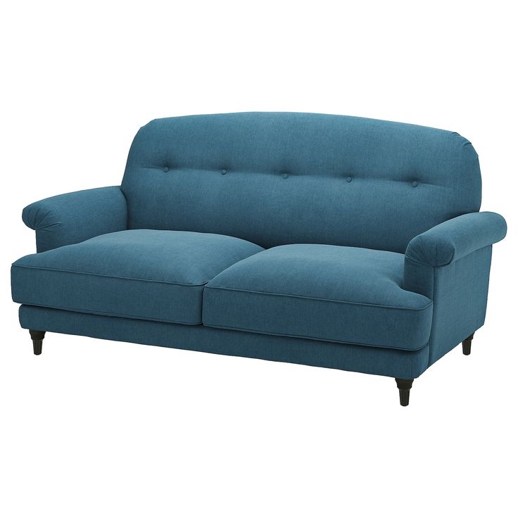 a blue couch sitting on top of a white floor