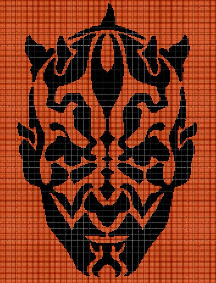 an orange and black cross - stitch pattern with the shape of a lion's head