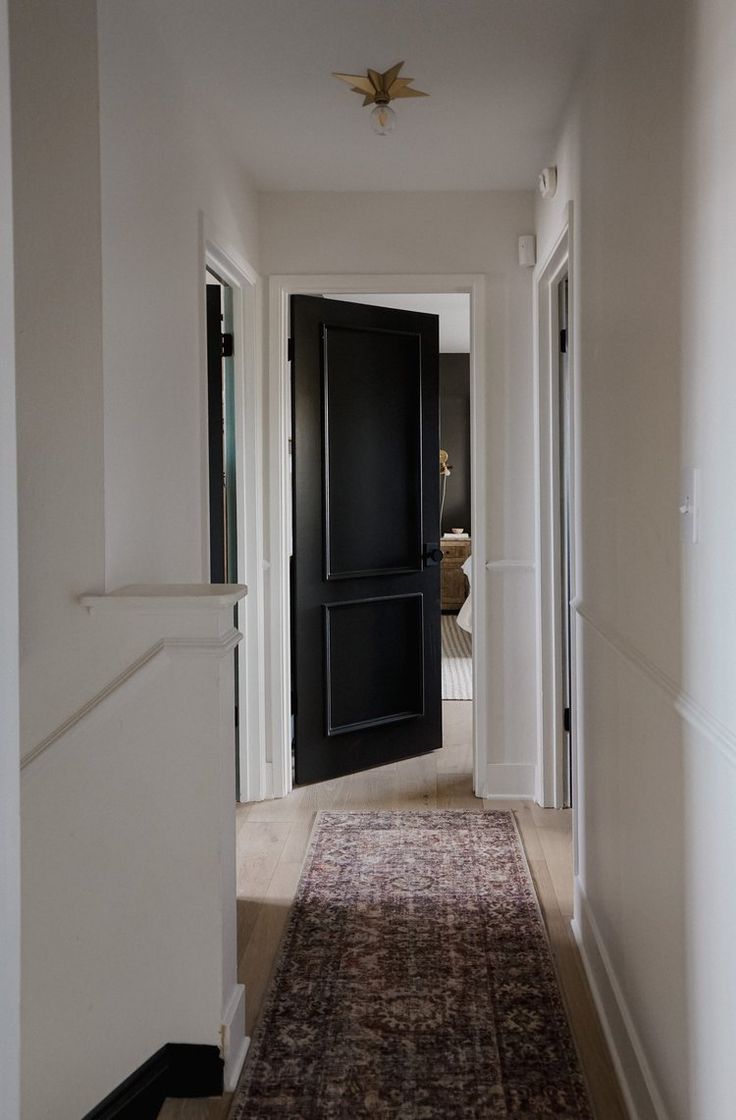 the hallway is clean and ready to be used as an entrance way for someone's home