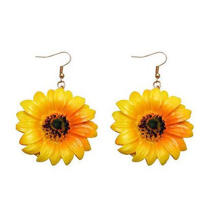 Sunflowers Earrings Feel the warmth of summer with our elegant Sunflowers Earrings. Handcrafted with intricate details, these earrings radiate beauty and grace. Make a statement with this timeless piece of jewelry that will elevate any outfit. Perfect for any occasion, these earrings are a must-have for any stylish woman. Sunflower Earrings, Costume Jewelry Earrings, Daisy Earrings, Acrylic Jewellery, Sunflower Design, Accessories Jewelry Earrings, Girls Earrings, Rhinestone Earrings, Flower Fashion