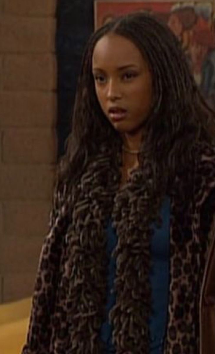 the young woman is wearing a leopard print coat