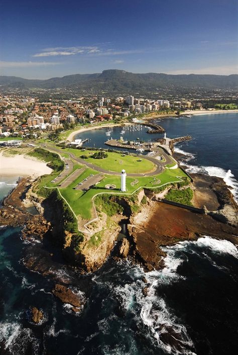 an aerial view of the coastline and city