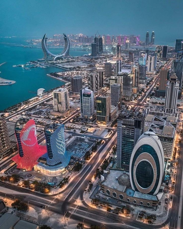 an aerial view of a city with tall buildings