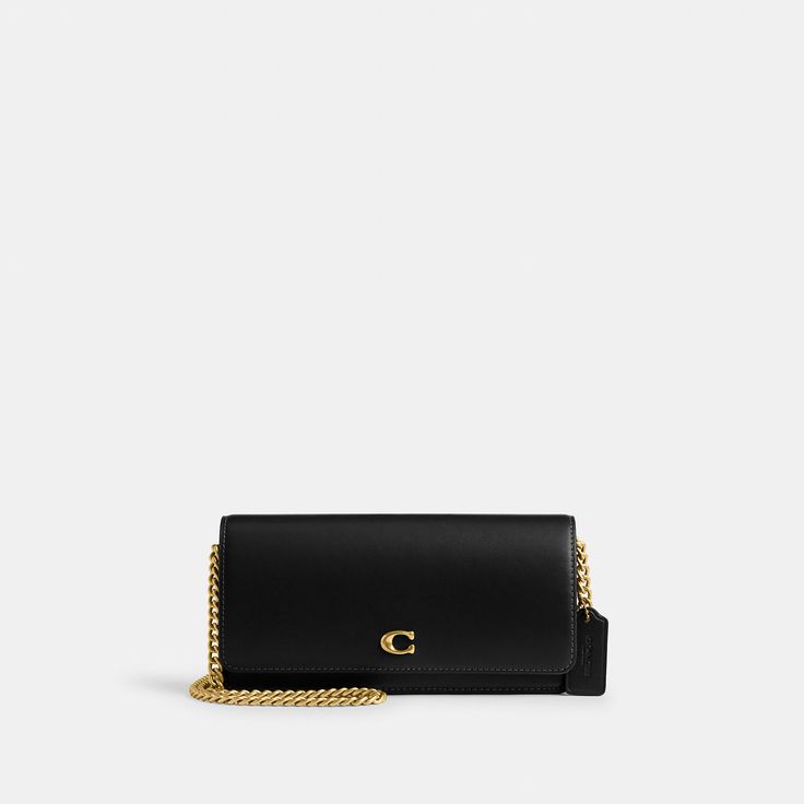 Form function and craftsmanship combine on our refined leather Evie Long Wallet. Detailed with our Signature hardware it has a convenient outside pocket and a spacious interior with multiple card slots a billfold compartment and a zip pocket for coins plus space for the largest size phone. Toss in a bag carry as a clutch or wear crossbody with the detachable gleaming chain strap. | Coach Evie Long Wallet With Chain - Women's Designer Crossbody - Brass/black Classic Bifold Wallet On Chain With Card Slots, Leather Rectangular Wallet On Chain For Everyday Luxury, Leather Wallet On Chain For Everyday Luxury, Rectangular Business Wallet On Chain With Card Slots, Business Wallet On Chain With Card Slots, Formal Leather Wallet With Chain Strap, Coach Classic Rectangular Wallet On Chain, Timeless Rectangular Wallet On Chain For Everyday Use, Luxury Coach Wallet On Chain