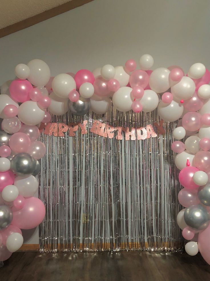 a birthday party with balloons and streamers