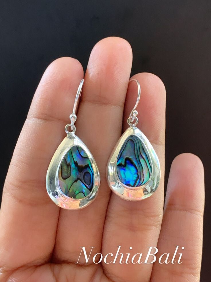 Abalone teardrop earring, Boho Teardrop earring, Sterling silver, Bohemian jewelry, Valentines day gift Our unique stunning Abalone shell earrings are lightweight These eye-catching earrings have a luminous color that really lights up your look Material: Sterling Silver, Abalone Shell Therefore, they may have slight variations Color and in appearance, pattern and color due to the nature of them. They have Length drop of about 1.6 inches and pendant length about 1 inch, width 0,7 inches. The earr Paua Shell Jewelry, Bohemian Jewelry Gift, Earrings Bali, Ubud Indonesia, Jewelry Valentines Day, Abalone Jewelry, Earrings Handmade Dangle, Hippie Earrings, Dragonfly Earrings