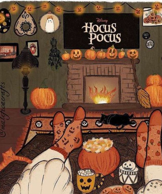 an image of a person laying in front of a fireplace with halloween decorations on it