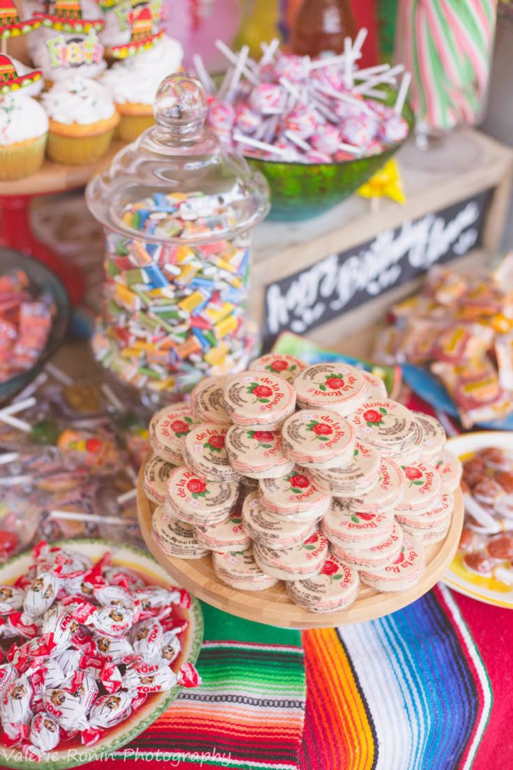 a table filled with lots of candy and candies on top of eachother