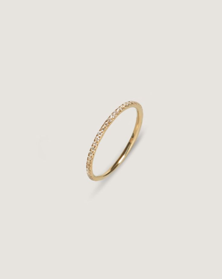 Whether you're celebrating a commitment to a partner or a modern milestone, this ring is an absolute classic for many years to come. A pavé setting originates from the French word “to pave”—and this gem has 0.125 carat weight diamonds set to add a bit of 'extra' to your every day. This is an eternity band with the diamonds set all the way around—if it's a custom size, please allow at least 5-7 business days for us to make the ring. 14k solid gold - always Weighs about 0.8 grams Ring is 1.3mm thi Micro Pave Ring, Fall Rings, Solitaire Diamond Ring, French Word, Round Solitaire, Solid Gold Band, Big Diamond, Golden Rule, Solitaire Diamond