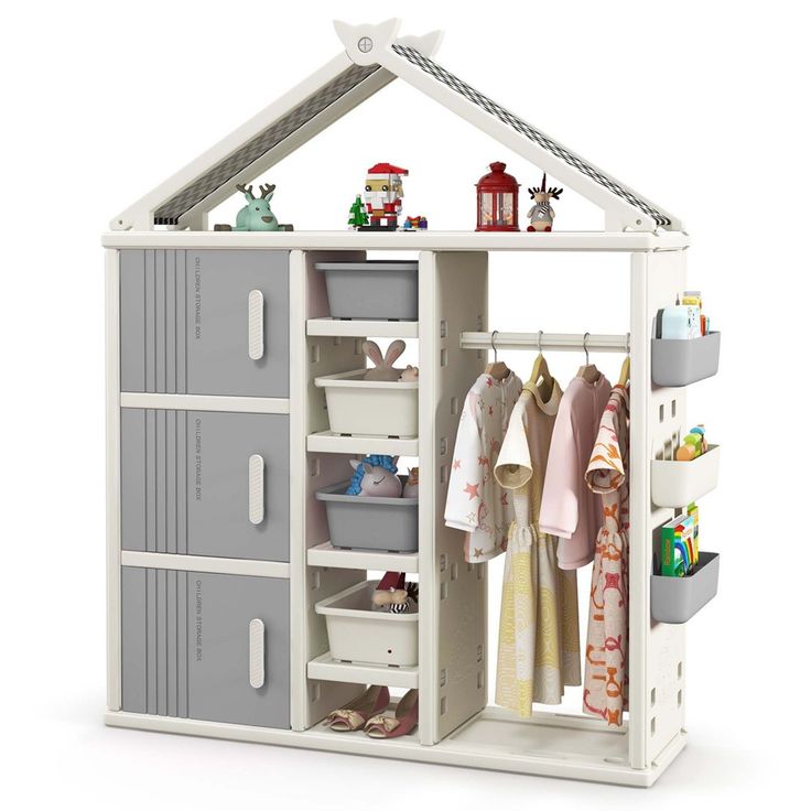 a toy dollhouse with clothes and toys in it