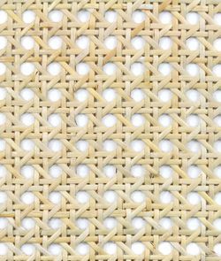 a close up view of a woven material with small holes in it's center