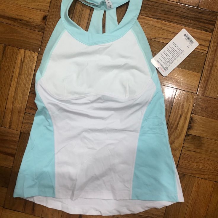 Bnwt Beautiful White And Teal Tank! Has A Back With Cutouts And Mesh, Great Condition And Sooo Gorgeous White Breathable Racerback Top, Breathable White Racerback Top, White Sleeveless Activewear For Beach, White Racerback Tops For Workout, White Fitted Tops For Light Exercise, Fitted White Tops For Light Exercise, White Racerback Top For Training, White Tops For Light Exercise In Spring, Sporty White Tank Top For The Beach