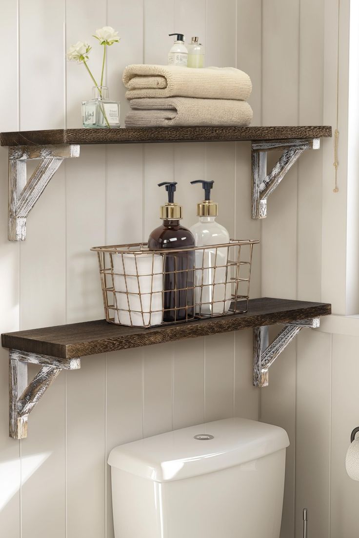 two shelves above a toilet in a bathroom