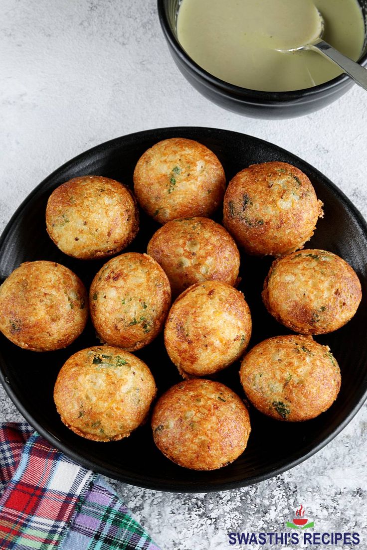 some food is in a black bowl on a table