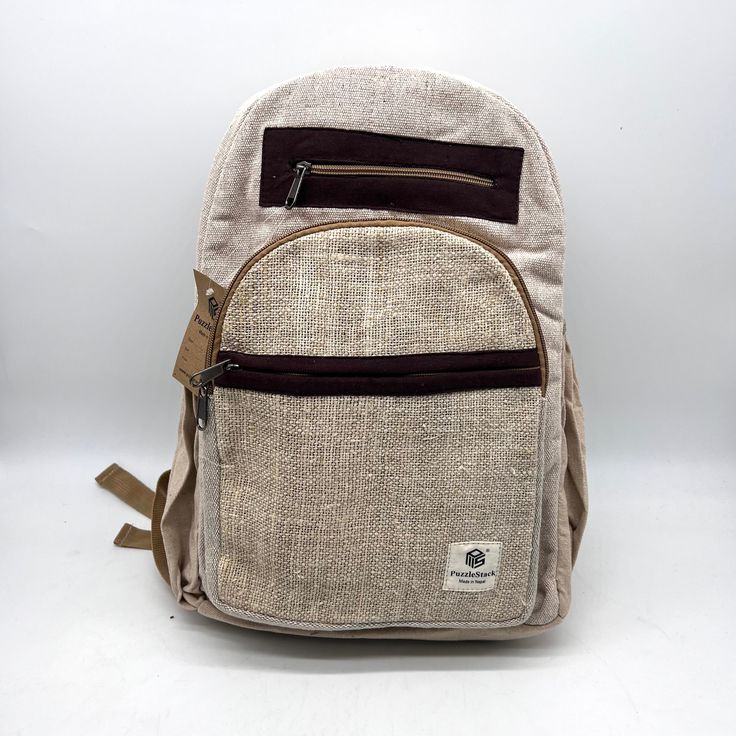 Introducing our handmade hemp backpack, a durable and eco-friendly option for carrying all your essentials. Crafted by skilled artisans, this backpack is made from high-quality hemp fiber and Heavy Duty Gheri Cotton fabric, known for its strength and durability. Not only is this backpack sturdy, but it also features a spacious interior with plenty of room for your laptop, books, and other daily necessities. The adjustable straps provide a comfortable fit, and the reinforced stitching ensures the backpack can withstand heavy use. But that's not all – our hemp backpack is also environmentally friendly. Hemp is a sustainable crop that requires minimal water and no pesticides, making it a popular choice for eco-conscious consumers. Plus, the backpack is handmade, so you can feel good knowing t Casual Hemp Bags For Daily Use, Eco-friendly Travel Backpack, Eco-friendly Backpack For Everyday Use, Eco-friendly Everyday Backpack In Natural Color, Eco-friendly Brown Backpack For Travel, Eco-friendly Handmade Backpack, Eco-friendly Brown Travel Backpack, Casual Natural Color Standard Backpack, Eco-friendly Brown Backpack For Everyday