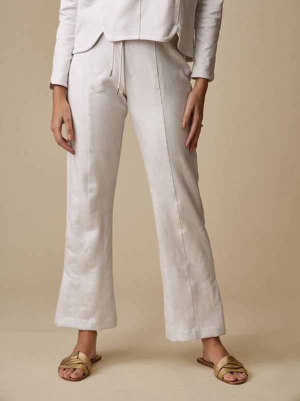 Santosa Lounge Collection | Holiday 2023 Linen Bottoms With Elastic Waistband For Lounging, Chic Lounging Pants In Solid Color, Chic Linen Bottoms For Loungewear, Chic Linen Loungewear Bottoms, Linen Sweatpants With Elastic Waistband For Loungewear, Loungewear Pants With Elastic Side Panels And Tapered Leg, Solid Bottoms With Elastic Side Panels And Tapered Leg, Athleisure Ankle-length Loungewear Pants, Athleisure Ankle Pants For Loungewear