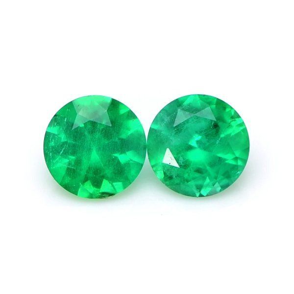 The beautiful, transparent pair of emeralds are 0.71 carats and 0.70 carats respectively. They are round green emeralds, with the dimensions of 6.14 x 6.10 x 3.85 mm and 6.10 x 6.08 x 3.80 mm and are mixed brilliant cut, have a clarity grade of slightly included (graded at eye level), vivid color intensity, and an excellent polish. #emerald #emeralds #finejewellery #jewelryinspiration #gemstones Green Round Cut Emerald, Green Round Cut Emerald Gemstones, Round Cut Green Emerald Gemstones, Round Green Emerald Gemstones, Brilliant Cut Green Emerald Gemstones, Gia Certified Green Round Cut Gemstones, Gia Certified Round Green Gemstones, Loose Emeralds, Vivid Color