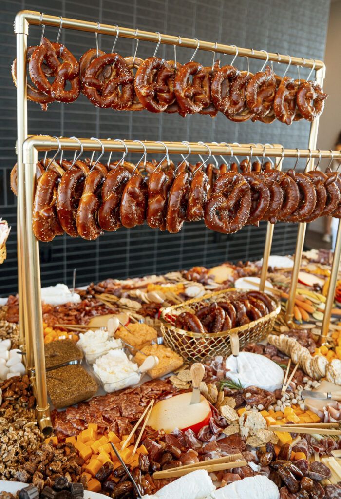 several different types of donuts on display in a buffet area at a wedding reception