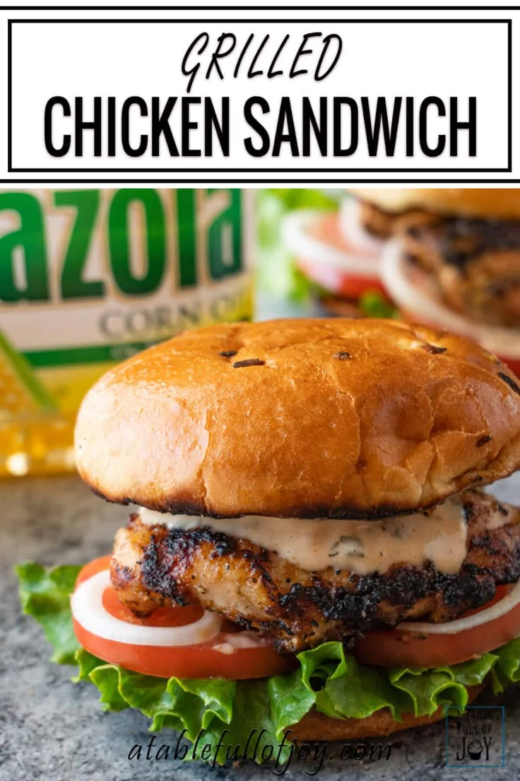 grilled chicken sandwich with lettuce, tomato and mayonnaise on a bun