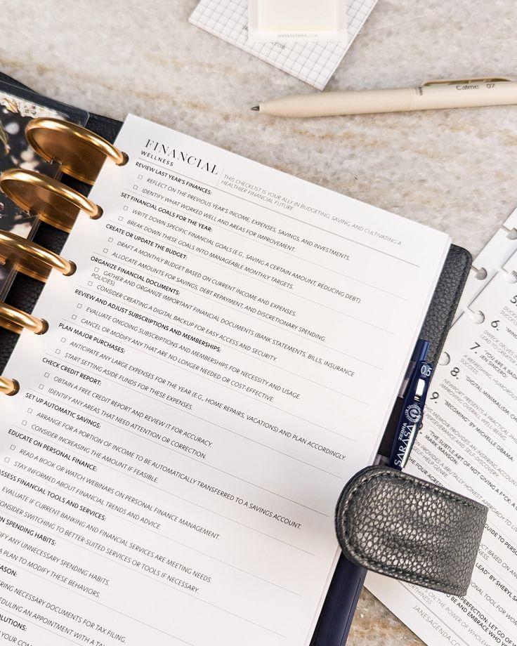 an open planner sitting on top of a table