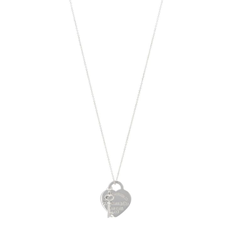 This is an authentic TIFFANY Sterling Silver Return to Tiffany Heart Tag Key Pendant Necklace. The necklace is crafted of sterling silver and features a heart tag pendant engraved with the Please Return to Tiffany motif and a miniature key charm. Tiffany Pendant, Return To Tiffany, Key Pendant Necklace, Heart Tag, Key Pendant, Tiffany Heart, A Heart, Miniatures, Pendant Necklace