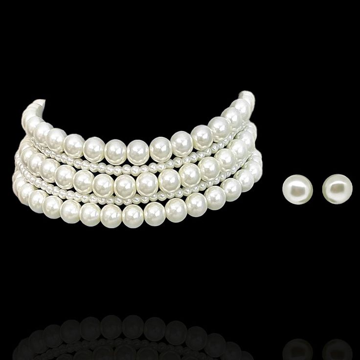 Encapsulating a contemporary yet classic aesthetic, making it an epitome of understated opulence and grace! This luxurious set is composed of lustrous pearls, exuding timeless elegance and modern refinement - perfect for an evening cocktail party. The set includes a choker and a pair of earrings. Silver-plated on high-quality brass as base metal. In-stock & ready-to-ship. *Please Note: We use faux stones and beads in all of our jewelry. Elegant Bridal Choker Necklace, Chic Evening Pearl Necklace, Chic Pearl White Necklace For Party, Chic Pearl White Pearl Necklace For Party, Classic Pearl Necklace For Party, Classic Pearl Necklace With Pearl Chain For Parties, Elegant Pearl Chain Jewelry For Parties, Elegant Pearl Jewelry For Parties, Elegant Pearl Bracelet For Party