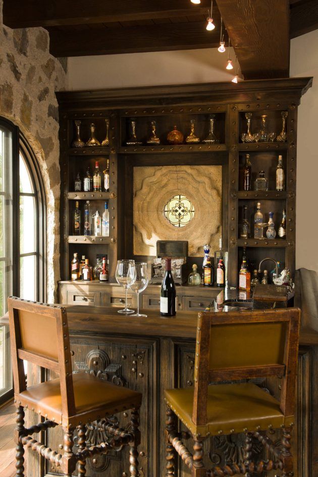 a bar with two stools next to it