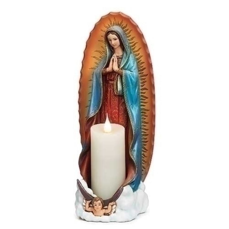 the virgin mary candle holder is holding a lit candle