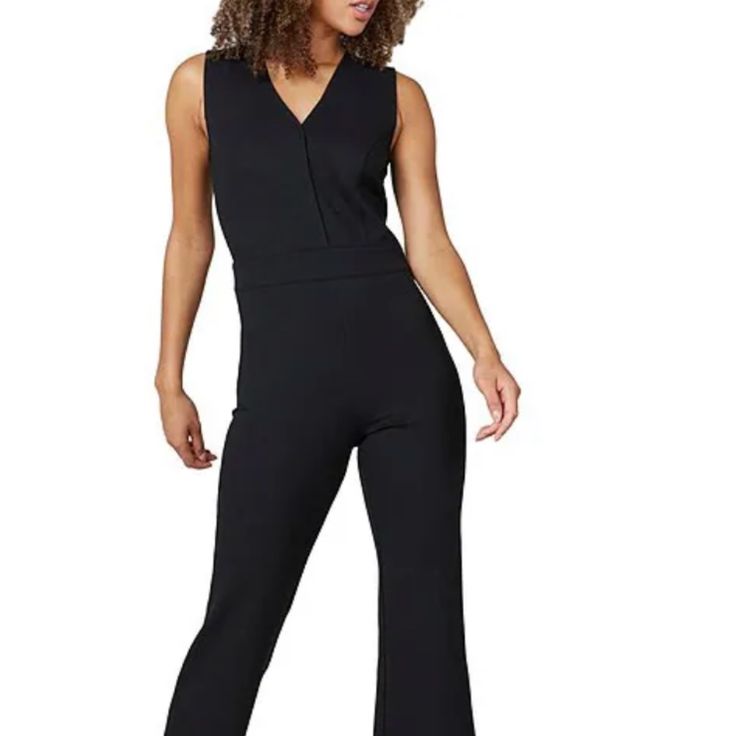 Very Flattering Jumpsuit/Pantsuit, Perfect For Work Or Travel, Looks Instantly Put Together And Professional Without Giving Up Comfort. Fabric Is Very Comfortable With A Thick Stretch Fabric And Garment Is Well-Made With Thoughtful Construction. One Of Spanx' Most Popular Items Because It Is Feminine And Very Female Figure Flattering. Please Note: Size Is Tall! I Am 5'9" And The Tall Is Perfect For Me In Length And Allows For A 1-2.5" Heel. I Should Have Bought An Extra Small (I Am A Size 4 Us) Elastane Jumpsuits And Rompers, Sleeveless Fitted Jumpsuits And Rompers For Formal Events, Tailored Sleeveless Jumpsuits And Rompers For Formal Occasions, V-neck Elastane Jumpsuit For Work, Fitted Jumpsuits And Rompers For Work, Fitted Elastane Jumpsuits And Rompers For Work, Fitted Elastane Jumpsuits For Work, Black Elastane Jumpsuits And Rompers For Work, Black Elastane Jumpsuits For Workwear